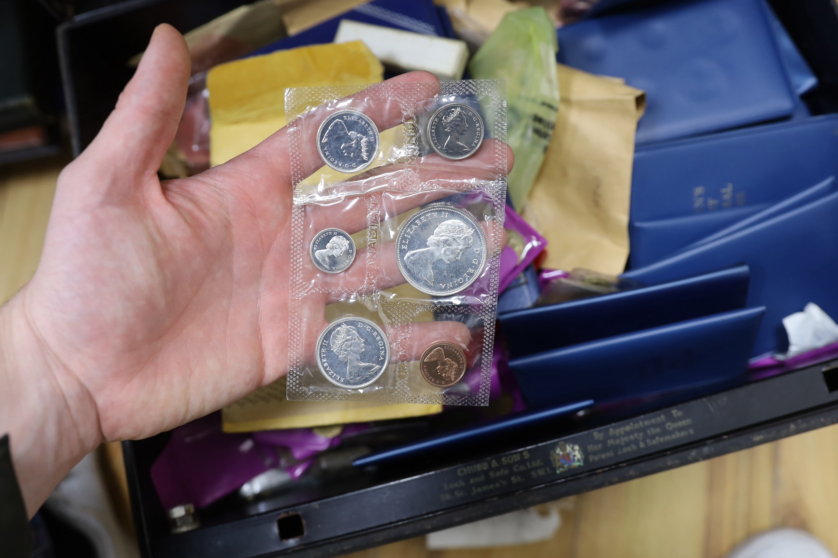 A large quantity of UK coins, mostly George V to Elizabeth II many UNC. in two metal boxes